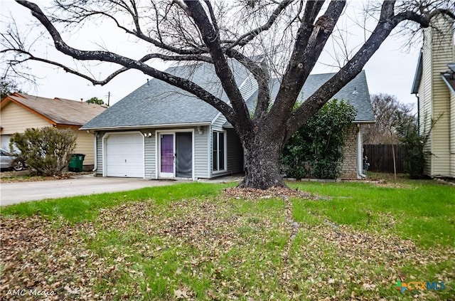 ranch-style house with a garage and a front lawn