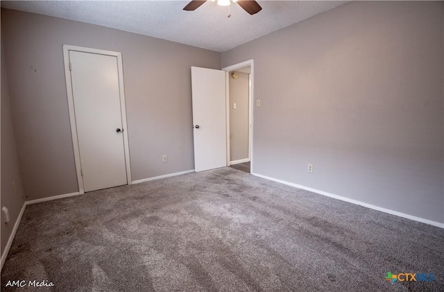 unfurnished bedroom with ceiling fan, carpet floors, and a textured ceiling