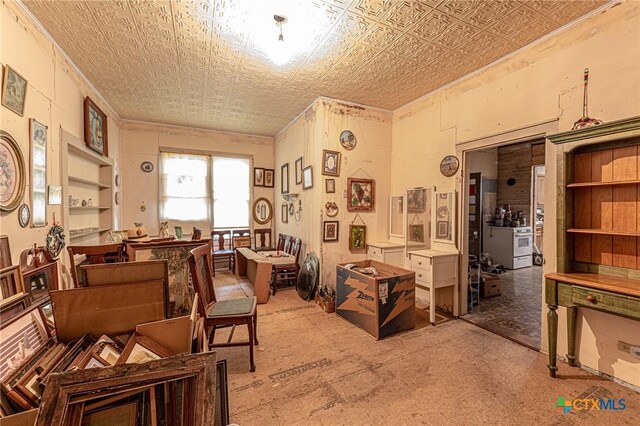 204 Ave F, Shiner, TX 77984 - misc room featuring light carpet, ornamental molding, and an ornate ceiling