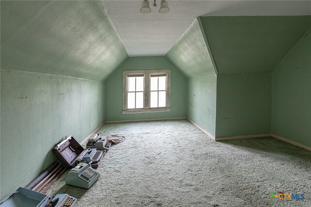 204 Ave F, Shiner, TX 77984 - bonus room featuring carpet flooring, vaulted ceiling, and baseboards