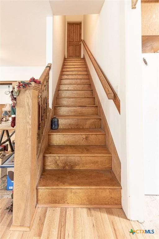 204 Ave F, Shiner, TX 77984 - staircase featuring wood finished floors