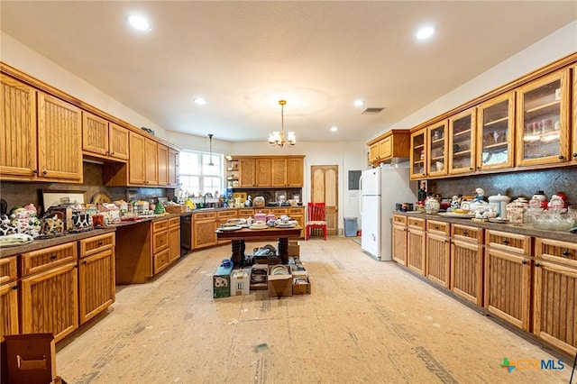 204 Ave F, Shiner, TX 77984 - kitchen with brown cabinetry, tasteful backsplash, black dishwasher, freestanding refrigerator, and open shelves