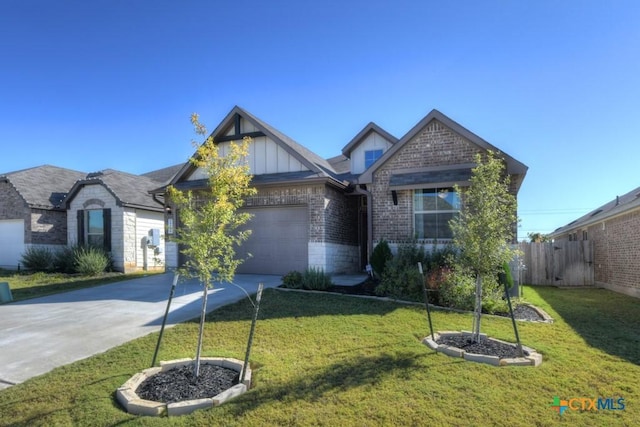 view of front facade with a front yard and a garage