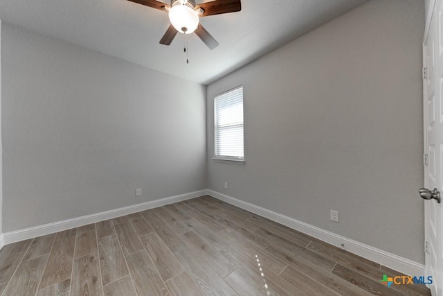 empty room with ceiling fan and light wood-type flooring