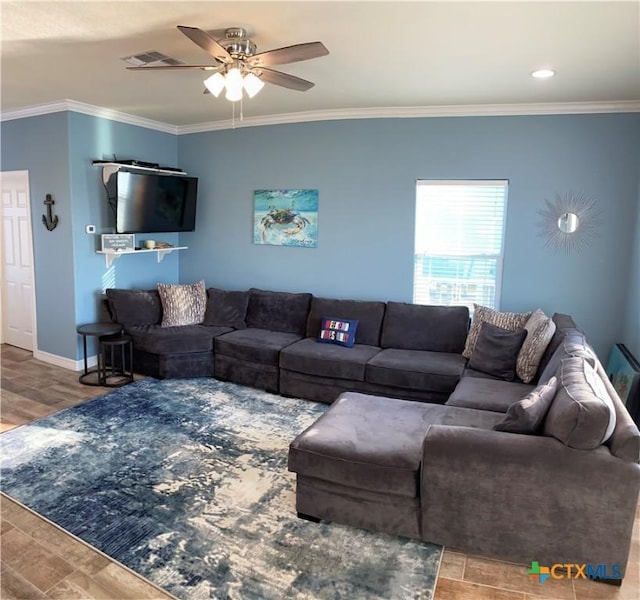 2790 Fm 2031, Matagorda, TX 77457 - living area with ornamental molding, a ceiling fan, wood finished floors, and baseboards