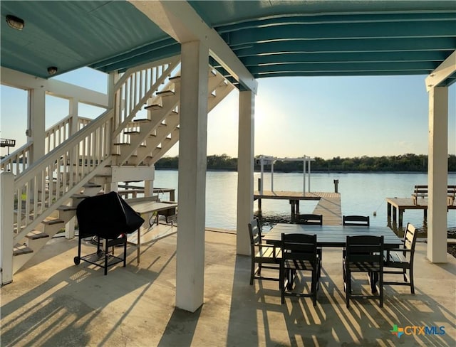 2790 Fm 2031, Matagorda, TX 77457 - view of patio / terrace with a boat dock, stairway, a water view, and boat lift
