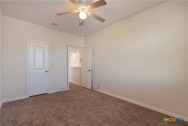 unfurnished bedroom with ceiling fan and carpet