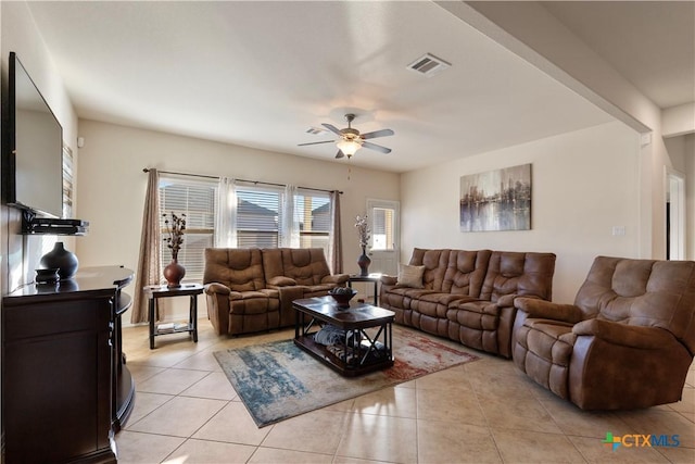 tiled living room featuring ceiling fan