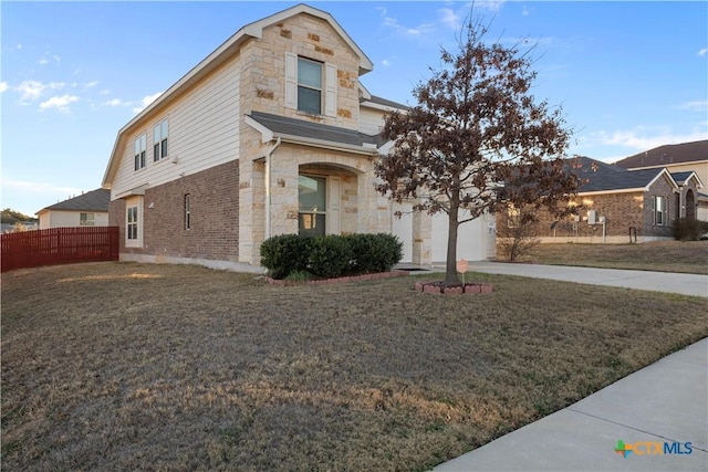 front of property with a garage and a front yard