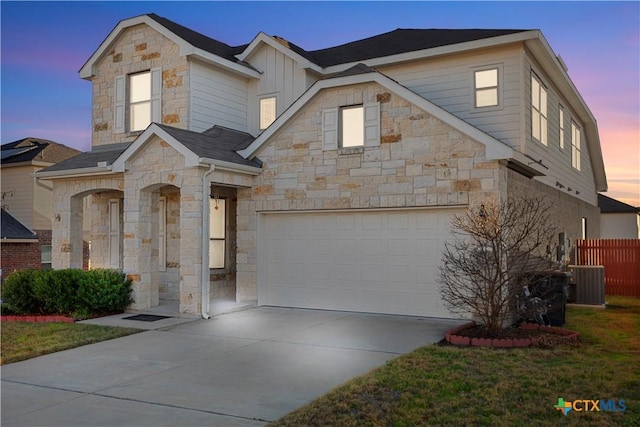 view of front facade featuring a yard and a garage