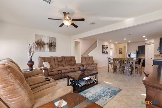 tiled living room featuring ceiling fan