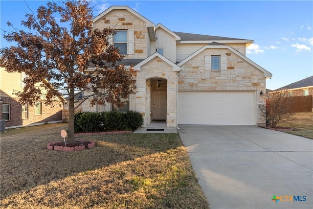 view of front of home with a garage and a front lawn