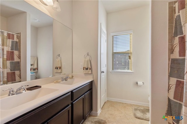 bathroom featuring tile patterned floors and vanity