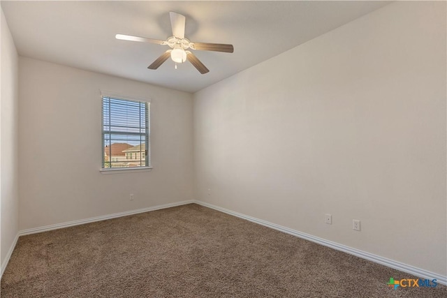 unfurnished room featuring ceiling fan and carpet flooring