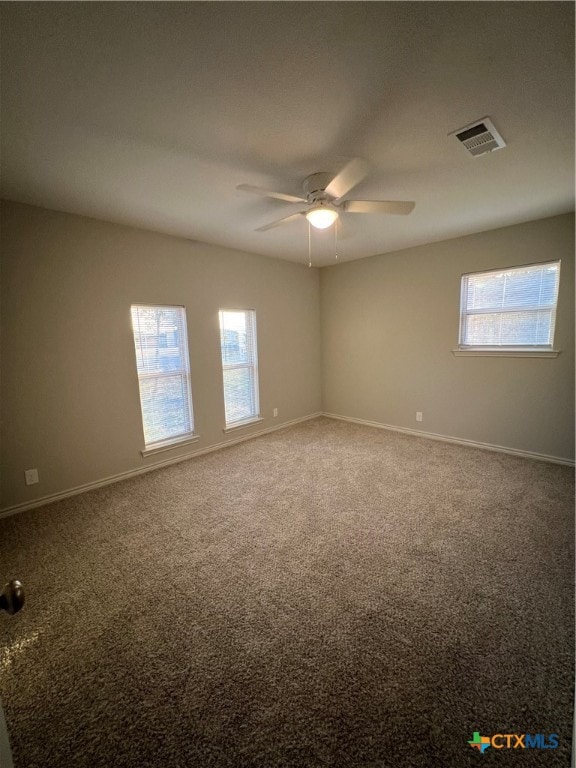 carpeted empty room with ceiling fan