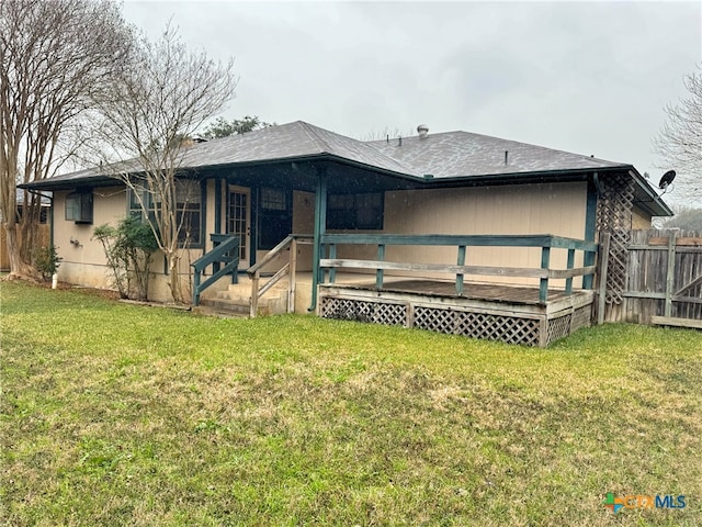 back of house featuring a yard