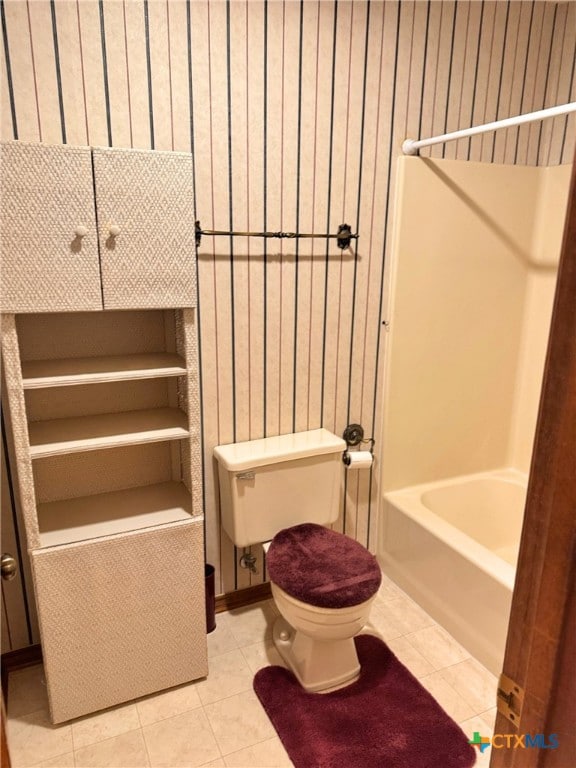 bathroom with tile patterned flooring and toilet