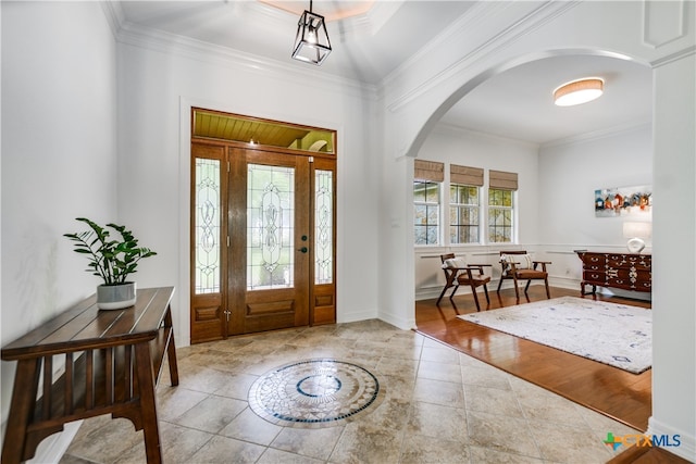 112 Oak Plaza Dr, Georgetown, TX 78628 - tiled entrance foyer featuring arched walkways and crown molding