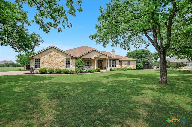 112 Oak Plaza Dr, Georgetown, TX 78628 - ranch-style house with stone siding, a chimney, and a front yard