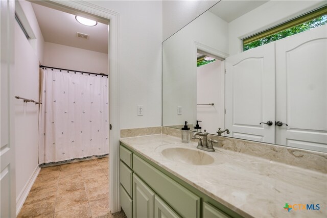 112 Oak Plaza Dr, Georgetown, TX 78628 - bathroom with vanity and a shower with curtain