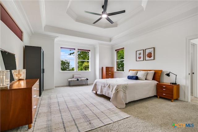 112 Oak Plaza Dr, Georgetown, TX 78628 - bedroom with light carpet, multiple windows, crown molding, a tray ceiling, and baseboards