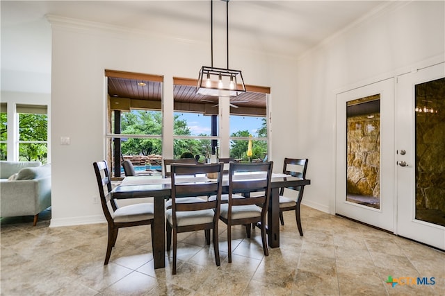 112 Oak Plaza Dr, Georgetown, TX 78628 - dining space featuring french doors, ornamental molding, and baseboards