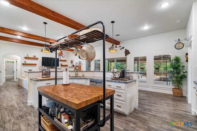 3006 Beulah Blvd, Belton, TX 76513 - kitchen with white cabinets, beam ceiling, arched walkways, dark wood finished floors, and open shelves