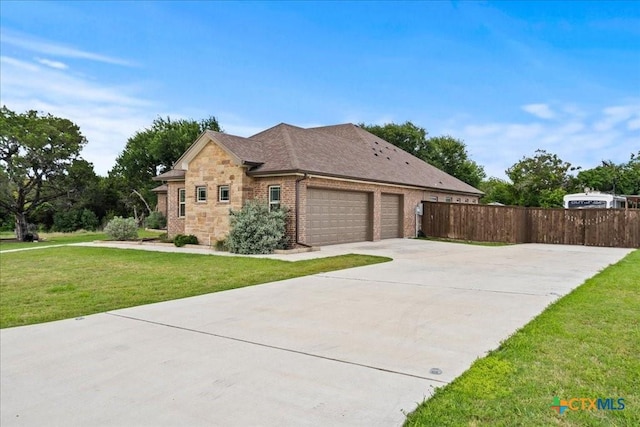 3006 Beulah Blvd, Belton, TX 76513 - view of front of property featuring concrete driveway, an attached garage, stone siding, brick siding, and roof with shingles
