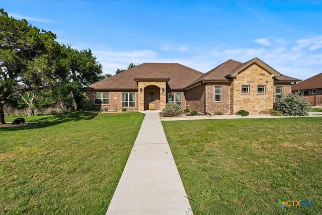 3006 Beulah Blvd, Belton, TX 76513 - view of front of property with a front yard, brick siding, stone siding, and a shingled roof