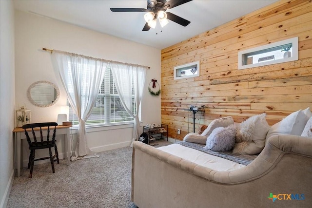3006 Beulah Blvd, Belton, TX 76513 - living area featuring carpet flooring, baseboards, wooden walls, and ceiling fan