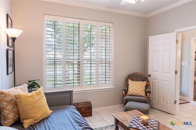 living area with light tile patterned floors, crown molding, plenty of natural light, and ceiling fan