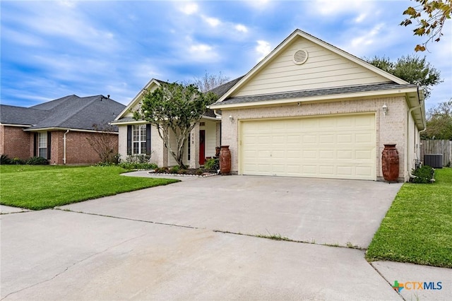 view of front of home featuring central AC, a garage, and a front lawn