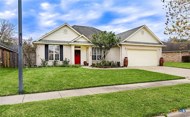 ranch-style home with a garage and a front yard