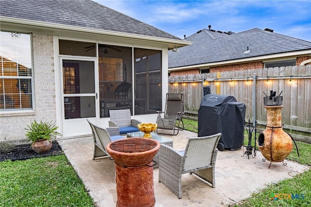 view of patio featuring a sunroom and area for grilling