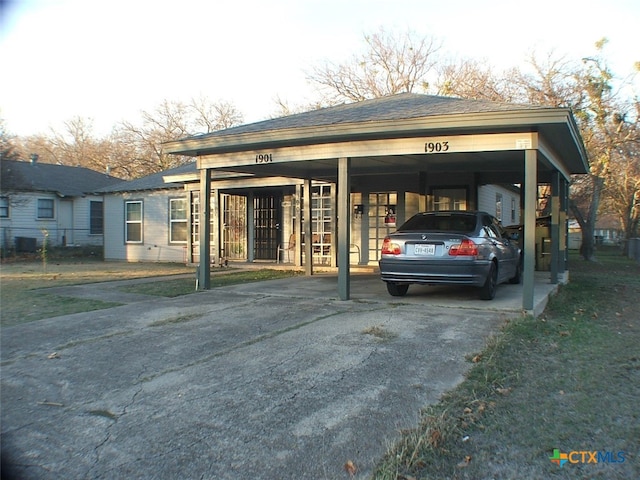 view of parking / parking lot featuring a carport