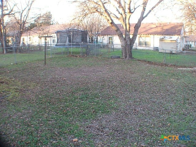 view of yard with a trampoline