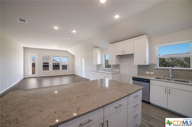 kitchen with dishwasher, plenty of natural light, white cabinetry, and dark hardwood / wood-style floors