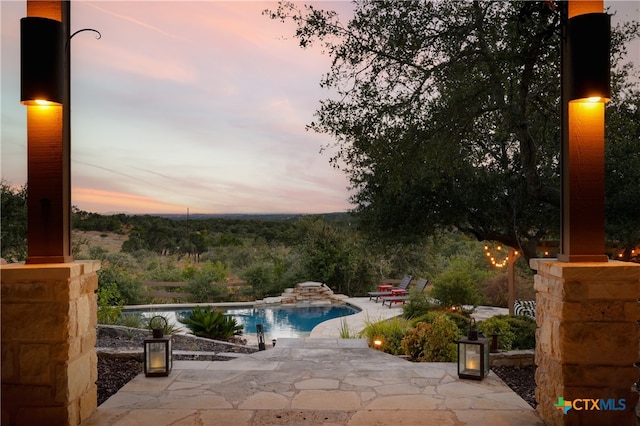 view of patio terrace at dusk