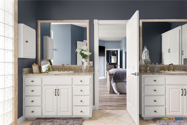 bathroom with vanity and hardwood / wood-style flooring