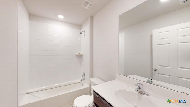 full bathroom with vanity, toilet, and tiled shower / bath