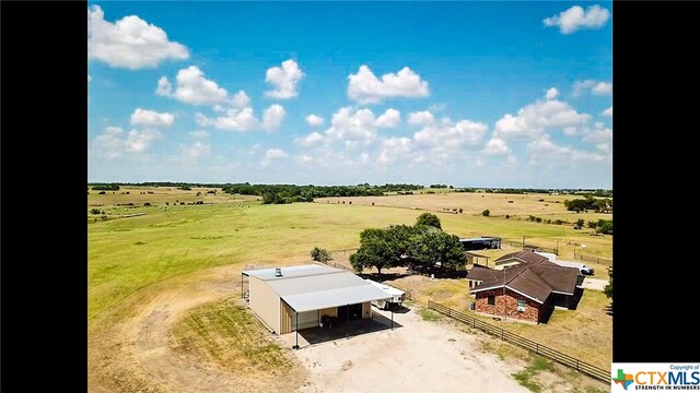 birds eye view of property with a rural view