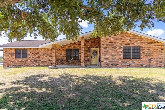 ranch-style house with a front lawn