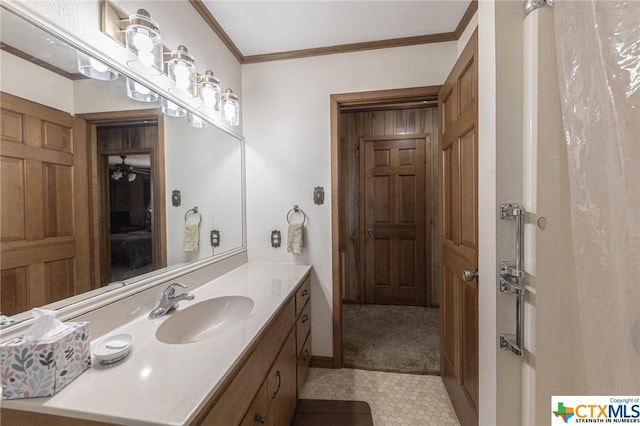 bathroom with vanity and ornamental molding