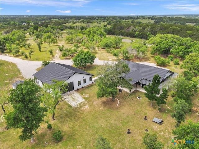 birds eye view of property with a forest view