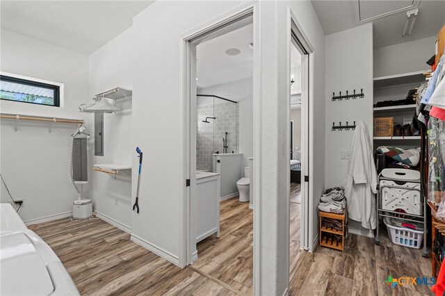 spacious closet featuring hardwood / wood-style flooring