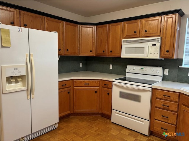 kitchen featuring decorative backsplash, white appliances, and light parquet floors