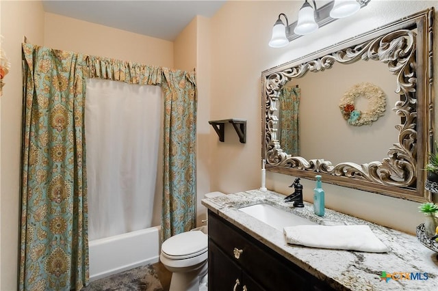 full bathroom featuring vanity, shower / tub combo, and toilet