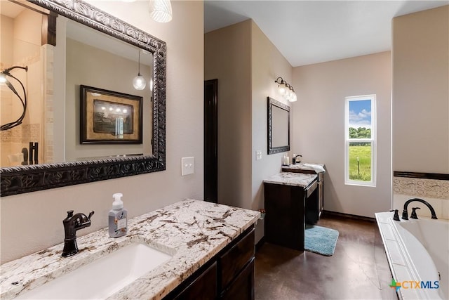 bathroom featuring a tub and vanity