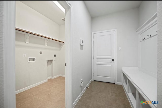 30125 Prairie Creek Ct, Brookshire, TX 77423 - laundry area featuring electric dryer hookup, hookup for a gas dryer, light tile patterned floors, and washer hookup