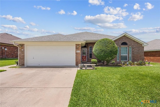 4105 Whispering Oaks, Temple, TX 76504 - ranch-style home with driveway, brick siding, a front lawn, and an attached garage